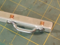 Fabricated bracket assembly for entry door hold open catch