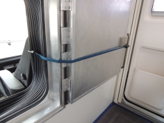 Installed footman's loop in passthrough for door open catch